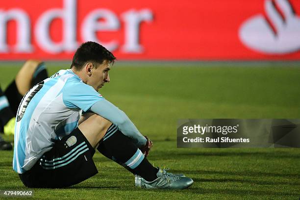 Dejected Lionel Messi of Argentina looks on after the 2015 Copa America Chile Final match between Chile and Argentina at Nacional Stadium on July 04,...