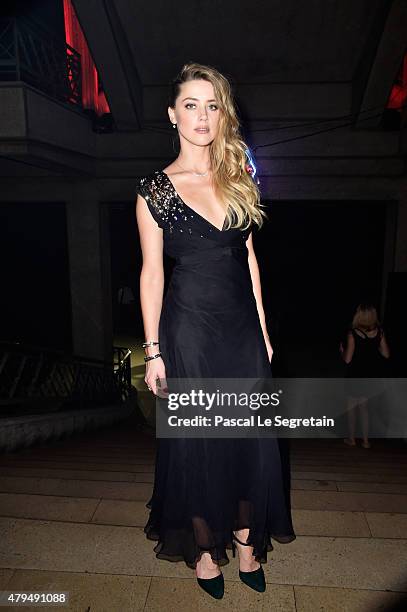 Amber Heard attends a cocktail during the Miu Miu Club launch of the first Miu Miu fragrance and croisiere 2016 collection at Palais d'Iena on July...