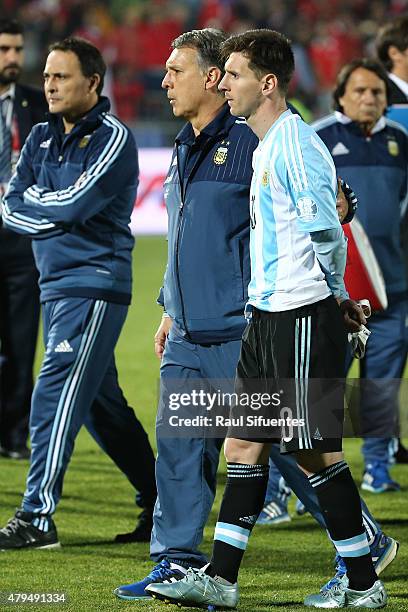 Gerardo Martino, coach of Argentina, and Lionel Messi of Argentina look dejected after the 2015 Copa America Chile Final match between Chile and...