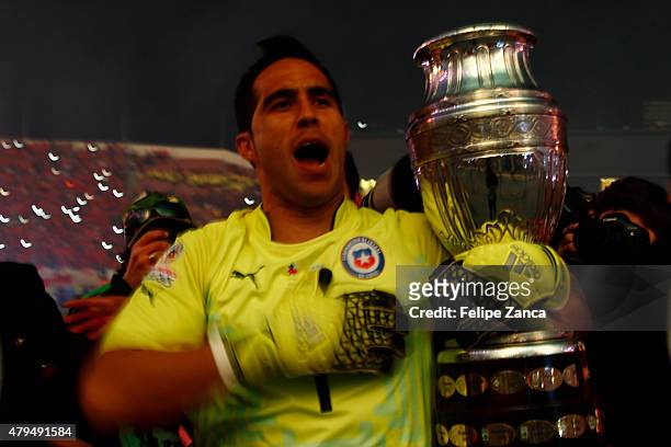 Claudio Bravo of Chile celebrates with the trophy after winning the 2015 Copa America Chile Final match between Chile and Argentina at Nacional...