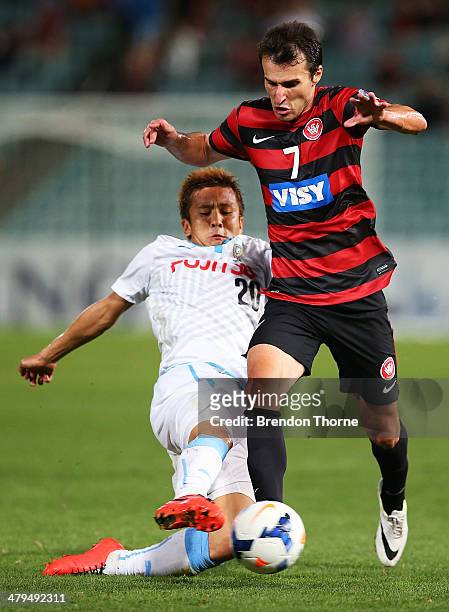 Labinot Haliti of the Wanderers competes with Junichi Inamoto of Kawasaki Frontale during the AFC Asian Champions League match between the Western...