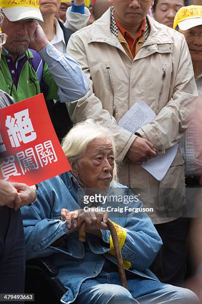 Political dissident Su Beng joins an anti-government protest. Opponents to the trade pact with China believe it'll be the death of Taiwan businesses.