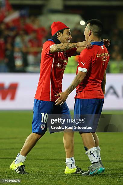 Jorge Valdivia of Chile fights for the ball with teammate Eduardo Vargas after winning the 2015 Copa America Chile Final match between Chile and...