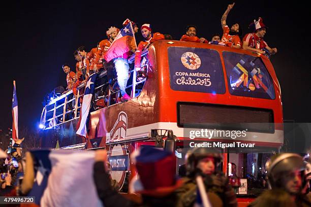 Players of Chile celebrate on the open top bus after winning the 2015 Copa America Chile Final match between Chile and Argentina at Nacional Stadium...