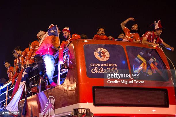Players of Chile celebrate on the open top bus after winning the 2015 Copa America Chile Final match between Chile and Argentina at Nacional Stadium...