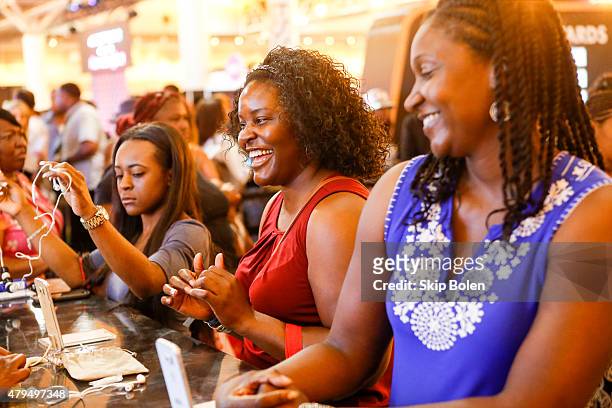 Festivalgoers attend the Samsung Galaxy Experience at the ESSENCE Festival on July 4, 2015 in New Orleans, Louisiana.