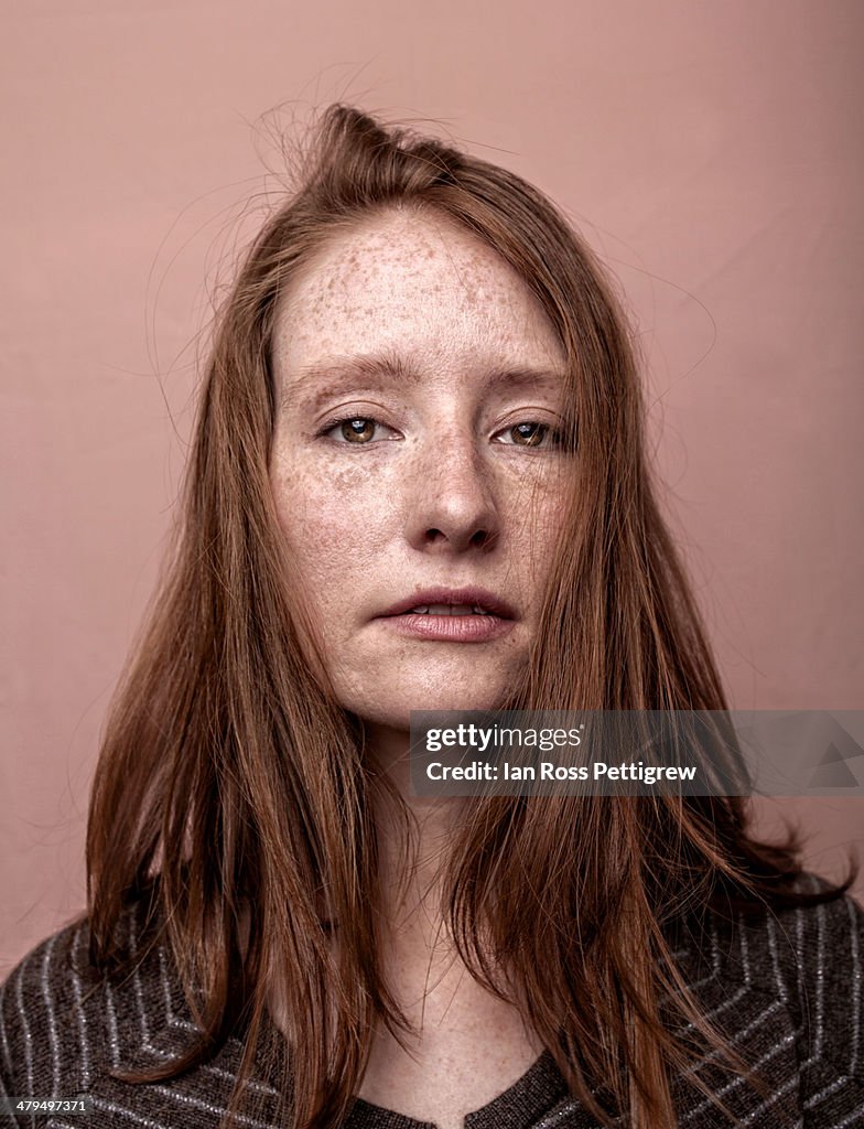 Redhaired, freckled model portrait