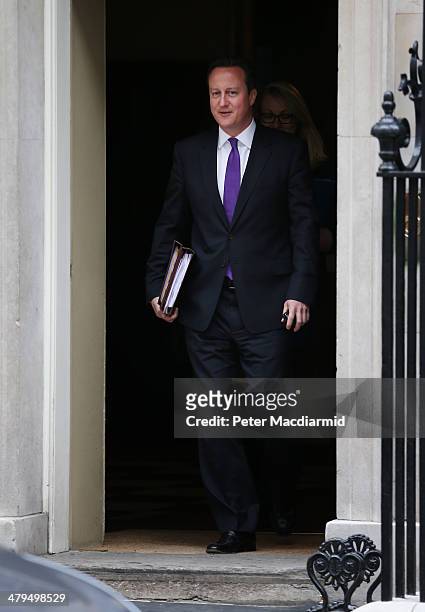 Prime Minister David Cameron leaves Downing Street for Parliament on March 19, 2014 in London, England. Later The Chancellor of the Exchequer George...