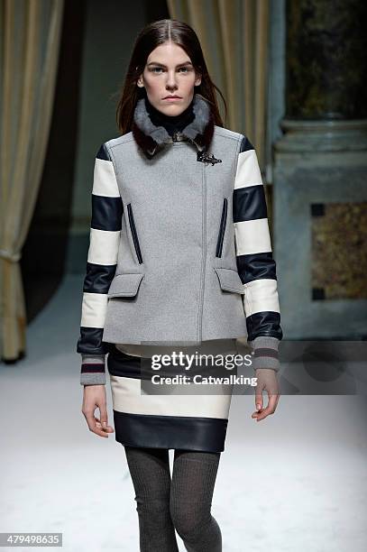 Model walks the runway at the Fay Autumn Winter 2014 fashion show during Milan Fashion Week on February 19, 2014 in Milan, Italy.