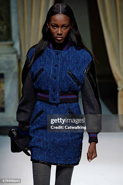 Model walks the runway at the Fay Autumn Winter 2014 fashion show during Milan Fashion Week on February 19, 2014 in Milan, Italy.