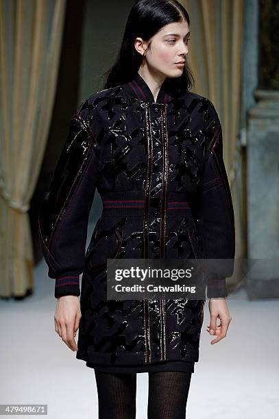 Model walks the runway at the Fay Autumn Winter 2014 fashion show during Milan Fashion Week on February 19, 2014 in Milan, Italy.