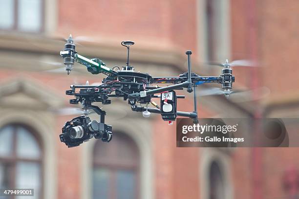 Journalist operates a drone outside the Pretoria High Court on March 19 in Pretoria, South Africa. Oscar Pistorius stands accused of the murder of...