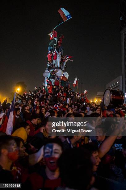 Fans of Chile celebrate their team's victory at Plaza Italia, following the 2015 Copa America Chile Final match between Chile and Argentina on July...