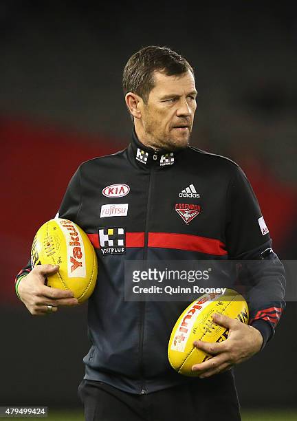 Mark Harvey the assistant coach of the Bombers looks on during the round 14 AFL match between the Essendon Bombers and the St Kilda Saints at Etihad...