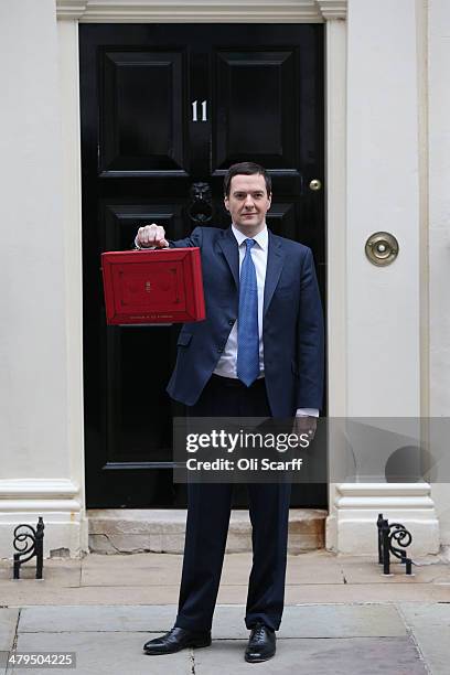 The Chancellor of the Exchequer George Osborne holding the budget box outside Number 11 Downing Street on March 19, 2014 in London, England. The...