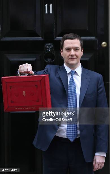 The Chancellor of the Exchequer George Osborne holding the budget box outside Number 11 Downing Street on March 19, 2014 in London, England. The...