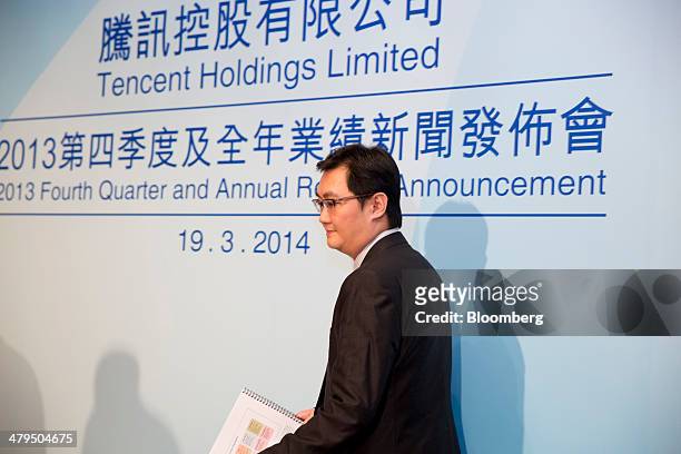 Ma Huateng, chairman and chief executive officer of Tencent Holdings Ltd., arrives for a news conference in Hong Kong, China, on Wednesday, March 19,...