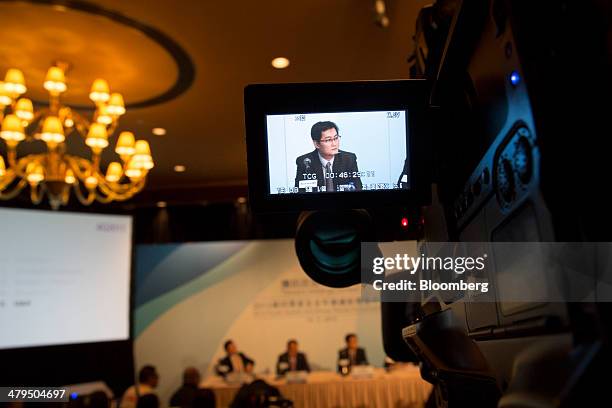 Ma Huateng, chairman and chief executive officer of Tencent Holdings Ltd., is seen on a camera viewfinder during a news conference in Hong Kong,...