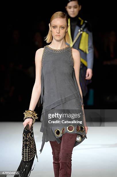 Model walks the runway at the Just Cavalli Autumn Winter 2014 fashion show during Milan Fashion Week on February 20, 2014 in Milan, Italy.