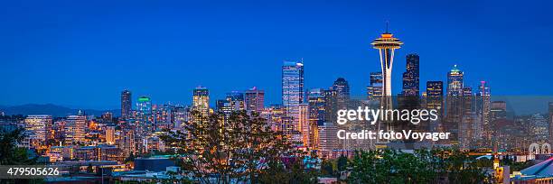 seattle space needle downtown skyscrapers illuminated dusk panorama washington usa - elliott bay towers stock pictures, royalty-free photos & images