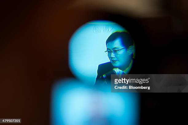Ma Huateng, chairman and chief executive officer of Tencent Holdings Ltd., is seen on a camera viewfinder as he speaks during a news conference in...