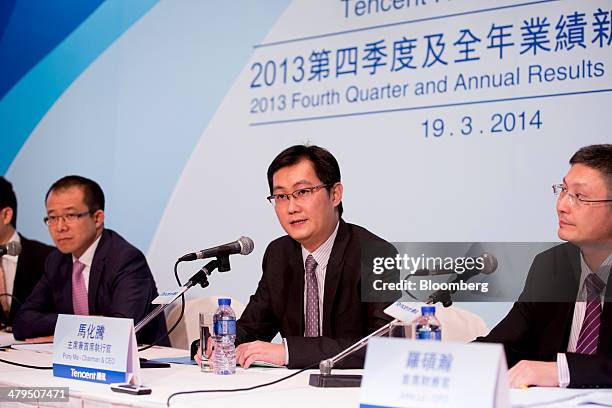 Ma Huateng, center, chairman and chief executive officer of Tencent Holdings Ltd., speaks during a news conference in Hong Kong, China, on Wednesday,...