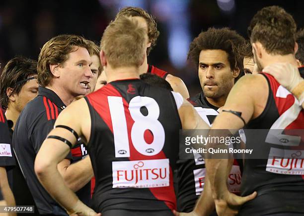 James Hird the coach of the Bombers talks to his players during the round 14 AFL match between the Essendon Bombers and the St Kilda Saints at Etihad...