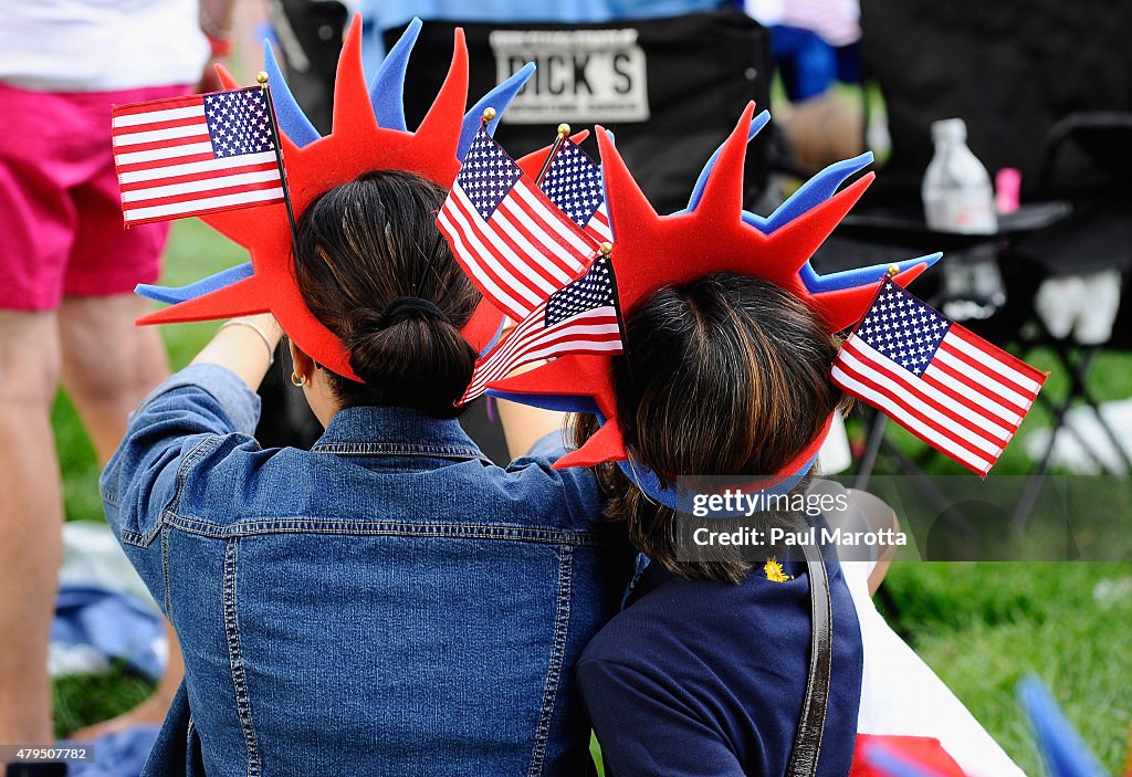Festive hats as thousands attend the Boston Pops Fourth Of July... News