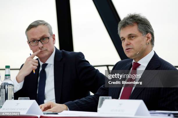 Wolfgang Schreiber, chief executive officer of Bentley Motors Ltd., right, speaks during a news conference to announce the company's financial...