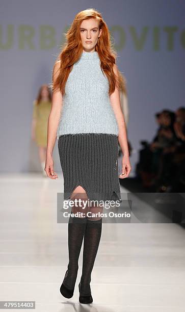 Model walks the runway wearing a creation by Malorie Urbanovitch & Matiere Noir during World Mastercard Fashion Week in Toronto on March 18, 2014....