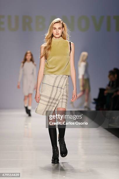 Model walks the runway wearing a creation by Malorie Urbanovitch & Matiere Noir during World Mastercard Fashion Week in Toronto on March 18, 2014....