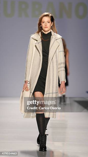 Model walks the runway wearing a creation by Malorie Urbanovitch & Matiere Noir during World Mastercard Fashion Week in Toronto on March 18, 2014....