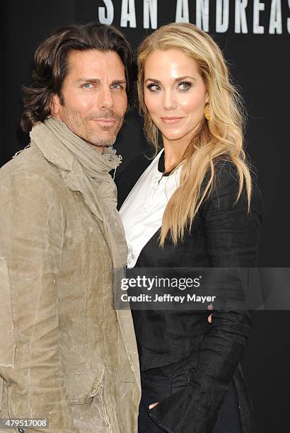 Artist Greg Lauren and actress Elizabeth Berkley arrive at the 'San Andreas' - Los Angeles Premiere at TCL Chinese Theatre IMAX on May 26, 2015 in...