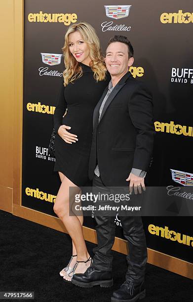 Actor David Faustino and guest arrive at the 'Entourage' Los Angeles premiere at Regency Village Theatre on June 1, 2015 in Westwood, California.
