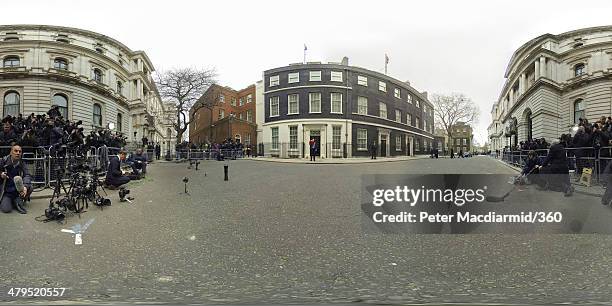 The Chancellor of the Exchequer George Osborne, holding the budget box, stands outside Number 11 Downing Street on March 19, 2014 in London, England....