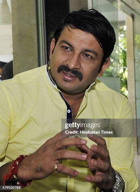 Manoj Tiwari, Bhojpuri singer-actor and BJP candidate from North East constituency for the 2014 Lok Sabha election during his interaction with the...