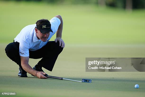 Alex Cejka of Germany lines up a putt during the first round of the Puerto Rico Open presented by seepuertorico.com held at Trump International Golf...