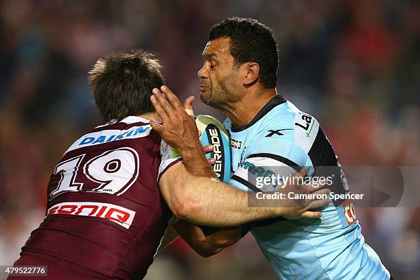 Jayson Bukuya of the Sharks is tackled during the round 17 NRL match between the Manly Sea Eagles and the Cronulla Sharks at Brookvale Oval on July...