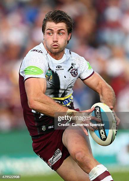 Kieran Foran of the Sea Eagles runs the ball during the round 17 NRL match between the Manly Sea Eagles and the Cronulla Sharks at Brookvale Oval on...