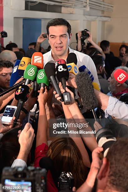 Greek Prime Minister Alexis Tsipras speaks to the press after placing his vote in the austerity referendum at a local school in the suburbs of Athens...