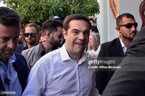 Greek Prime Minister Alexis Tsipras arrives at a local school in the suburbs of Athens to vote in the austerity referendum on July 5, 2015 in Athens,...