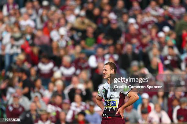 Daly Cherry-Evans of the Sea Eagles smiles as he waits for an referee's decision during the round 17 NRL match between the Manly Sea Eagles and the...