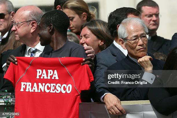 People attend Pope Francis' weekly audience in St. Peter's Square on March 19, 2014 in Vatican City, Vatican. Pope Francis celebrated the Feast of...