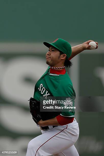 Junichi Tazawa of the Boston Red Sox throws a pitch in the ninth inning of a game against the St. Louis Cardinals at JetBlue Park at Fenway South on...