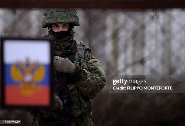 Russian soldier stands inside the Ukrainian navy south headquarters base in Novoozerne after it was taken over by Russian forces on March 19, 2014....