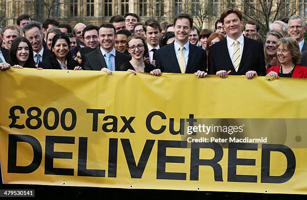 Deputy Prime Minister Nick Clegg stands near Parliament with Chief Secretary to the Treasury Danny Alexander to promote a tax cut announced in the...