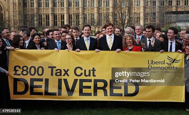 Deputy Prime Minister Nick Clegg stands near Parliament with Chief Secretary to the Treasury Danny Alexander to promote a tax cut announced in the...