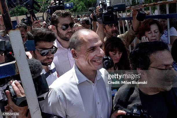 Greek Finance Minister Yanis Varoufakis surronded by press after placing his vote in the austerity referendum at a local school in the suburbs of...