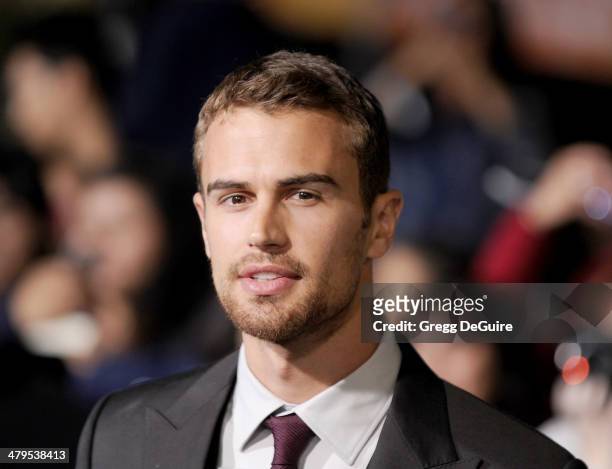 Actor Theo James arrives at the Los Angeles premiere of "Divergent" at Regency Bruin Theatre on March 18, 2014 in Los Angeles, California.