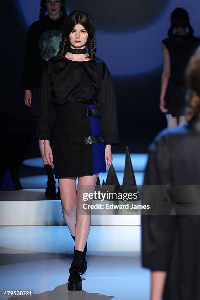 Model walks the runway during the Matiere Noir fashion show during World Mastercard fashion week on March 18, 2014 in Toronto, Canada.